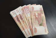 Ввести ограничения при снятии наличных через кассы предложили в МВД России