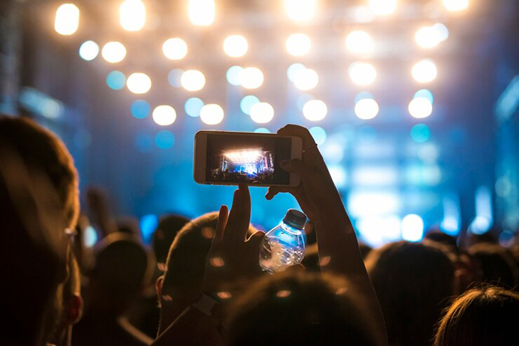 woman-crowd-taking-picture-stage-music-festival_342744-560.jpg